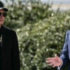 President Donald Trump and Tesla CEO Elon Musk stand at the South portico of the White House