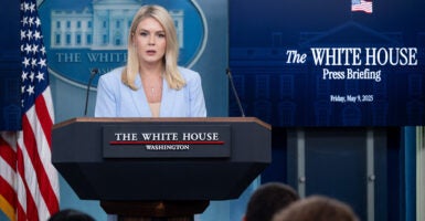 White House Press Secretary Karoline Leavitt in a light blue suit holds press briefing at the White House.