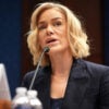 Katherine Maher sits and tilts her head to the left as she speaks into a microphone.