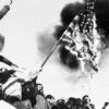 Black-and-white photo of Iranians burning an American flag in the days after Iran took dozens of Americans hostage.